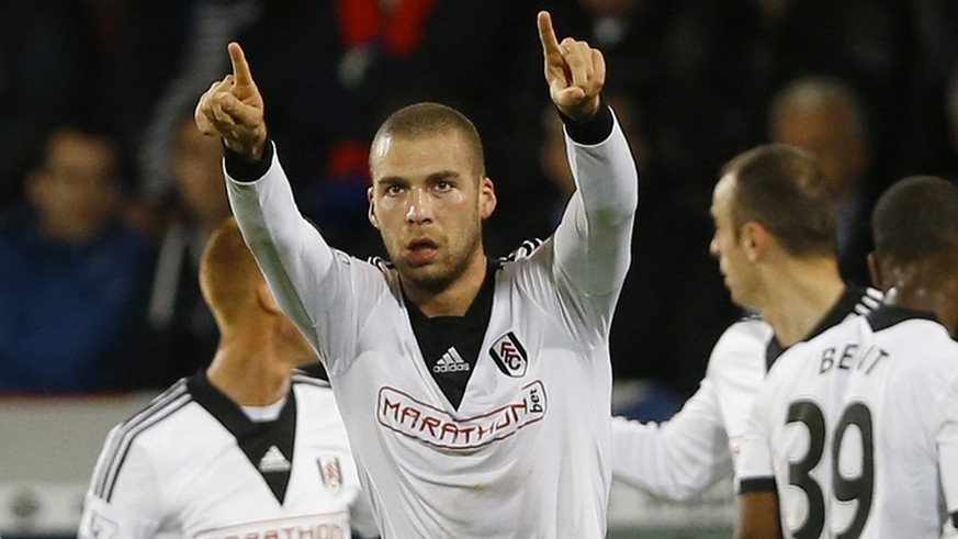 Fulham's Pajtim Kasami, center, celebrates scoring a goal during the English Premier League soccer match between Crystal Palace and Fulham at Selhurst Park Stadium in London, Monday, Oct. 21, 2013. (A ...