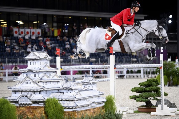 Martin Fuchs of Switzerland riding Clooney 51 competes during the equestrian jumping team qualifier at the 2020 Tokyo Summer Olympics in Tokyo, Japan, on Friday, August 6, 2021. (KEYSTONE/Laurent Gill ...