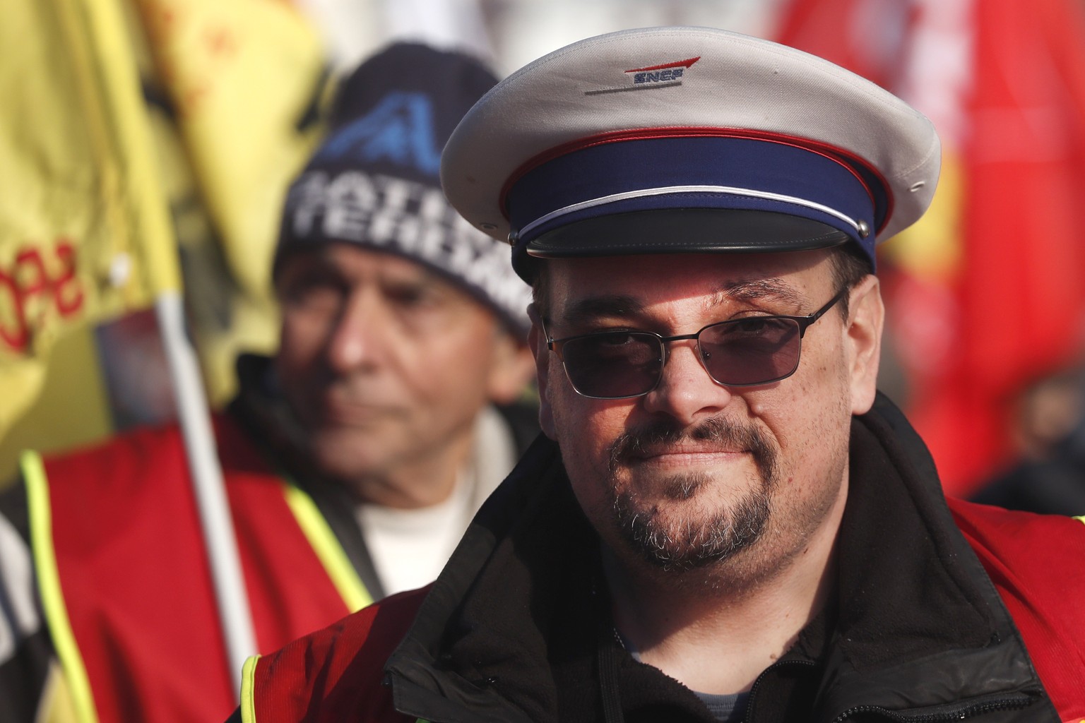 epa10440889 A man wearing a hat of France&#039;s national state-owned railway company (SNCF) takes part in a rally against the French government&#039;s planned reform of the pension system, in Montpel ...