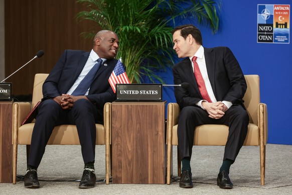 KEYPIX - epa12101562 British Foreign Secretary David Lammy (L) andUS Secretary of State Marco Rubio (R) chat during an informal meeting of North Atlantic Treaty Organization (NATO) Ministers of Foreig ...