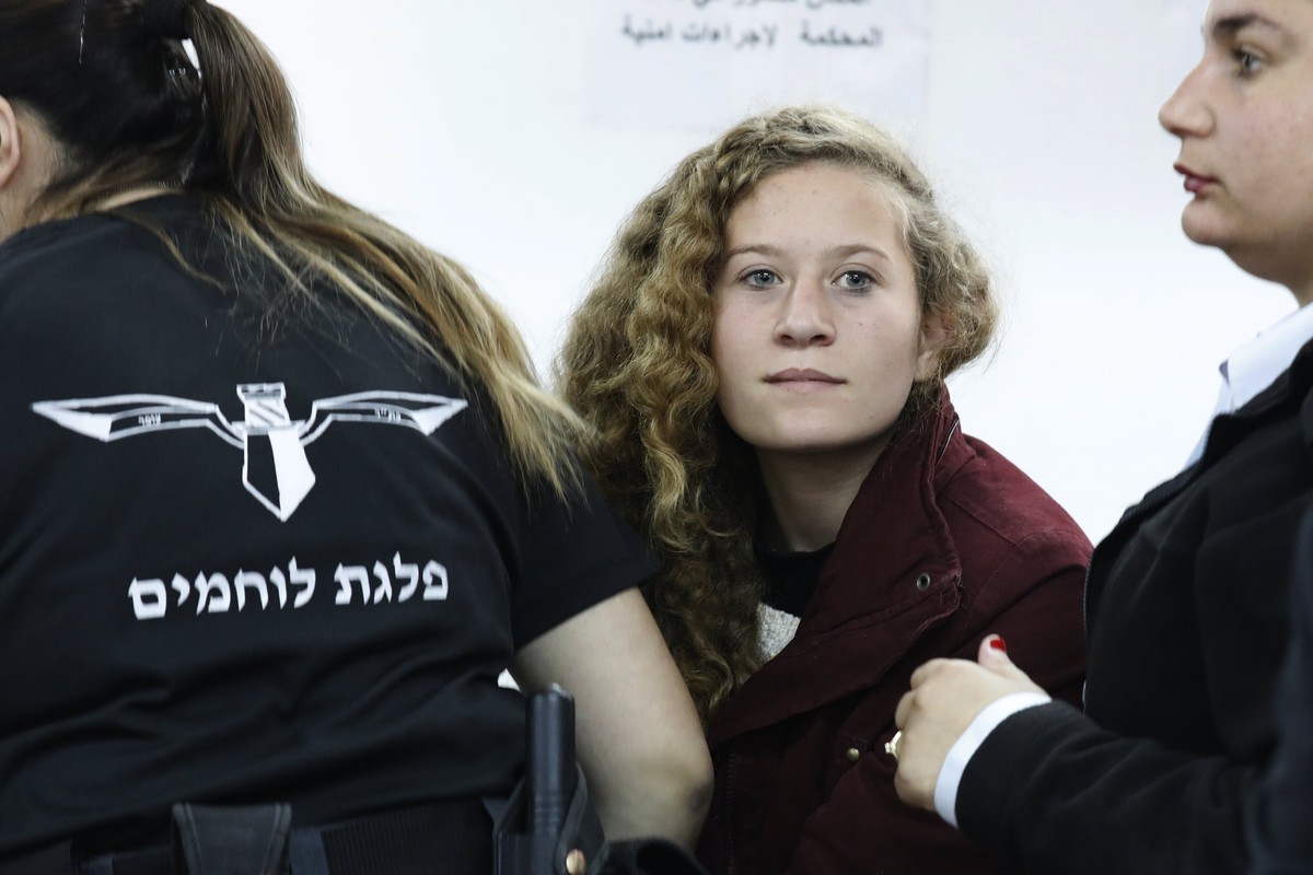 epa06412872 (FILE) - 17 year old Palestinian Ahed Tamimi (C), a campaigner against Israel's occupation, appears at a military court at the Israeli-run Ofer prison in the West Bank village of Betu ...