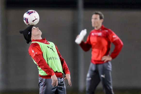 Switzerland&#039;s national soccer team players Xherdan Shaqiri, left, and Stephan Lichtsteiner, right, in action during a training session, in Vienna, Austria, Sunday, November 15, 2015. The Switzerl ...