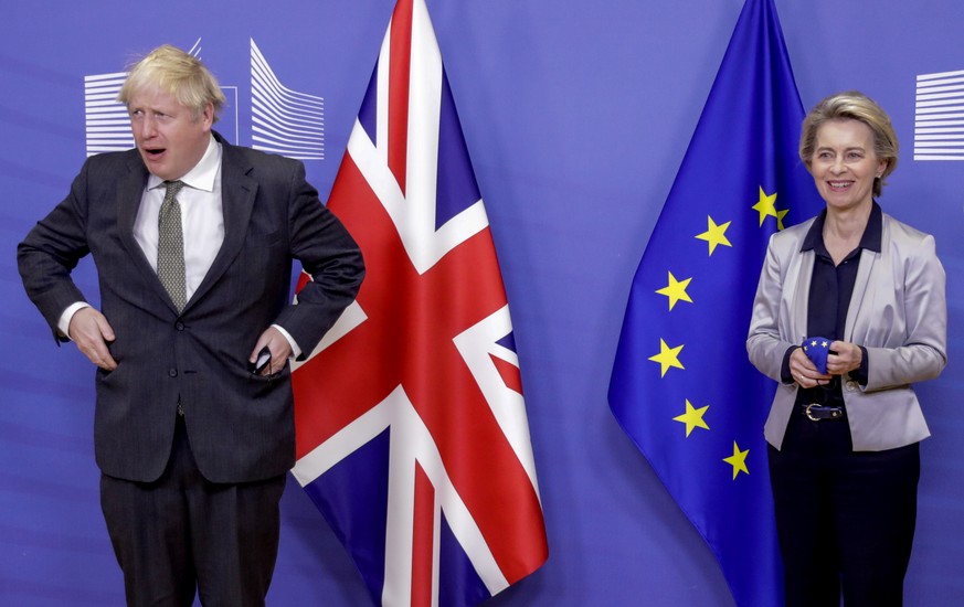 FILE - In this Wednesday, Dec. 9, 2020 file photo European Commission President Ursula von der Leyen, right, welcomes British Prime Minister Boris Johnson prior to a meeting at EU headquarters in Brus ...