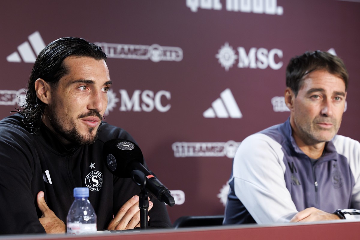 Servette's forward Enzo Crivelli, left, sitting next to Rene Weiler, right, coach of Servette FC, talks to the media, during a press conference after a training session of the Servette FC one day ...