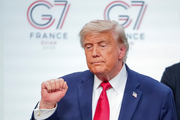 U.S. President Donald Trump gestures as he leaves the stage after a media conference at the end of the G7 summit in Evian-les-Bains, France, Wednesday, June 17, 2026. (AP Photo/Vadim Ghirda)
Donald Tr ...