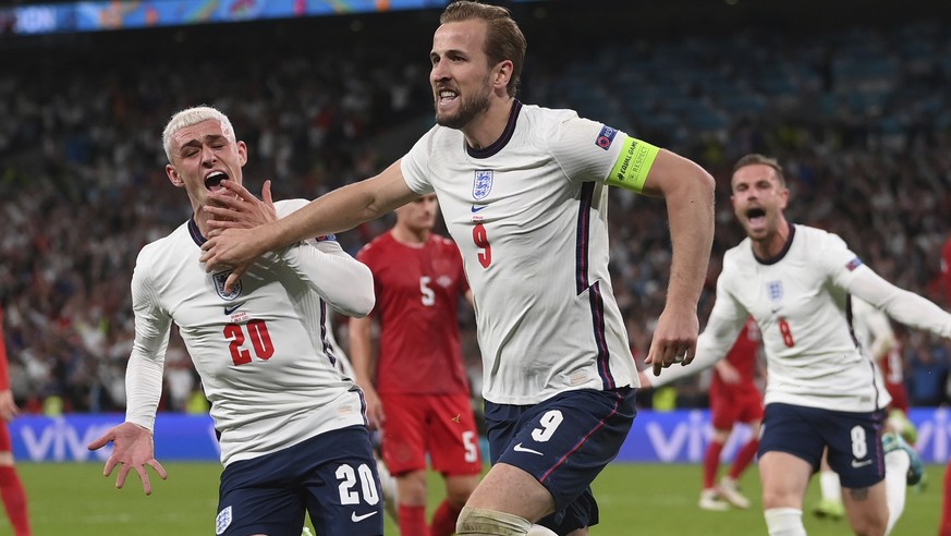England&#039;s Harry Kane, center, celebrates with his teammates after scoring his side&#039;s second goal during the Euro 2020 soccer semifinal match between England and Denmark at Wembley stadium in ...