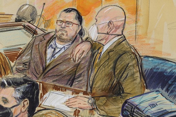 FILE - This artist sketch depicts Guy Wesley Reffitt, joined by his lawyer William Welch, right, in Federal Court, in Washington, on Feb. 28, 2022. Federal prosecutors are seeking a 15-year prison sen ...