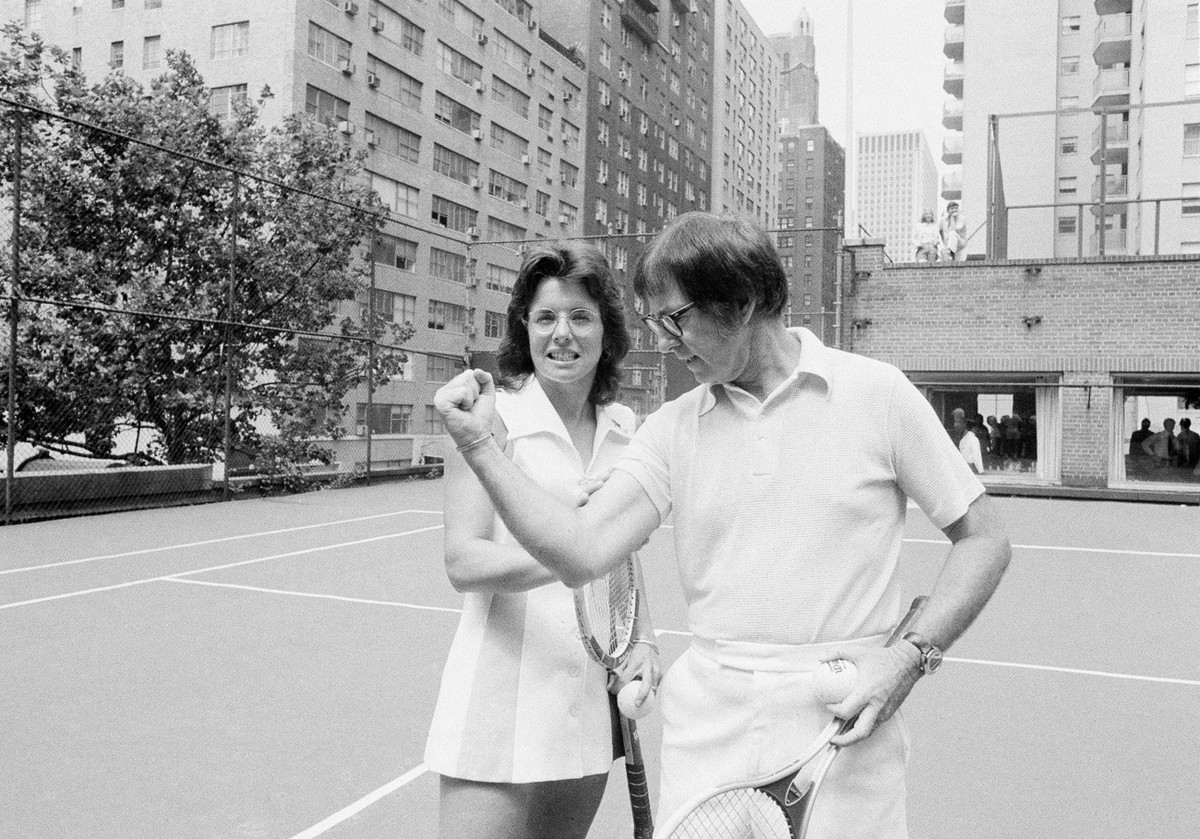 In this July 11, 1973 photo, Wimbledon champion Billie Jean King checks the muscle on her nemesis, Bobby Riggs, in New York. The story of the early days of the tour and King's fight for equal pri ...