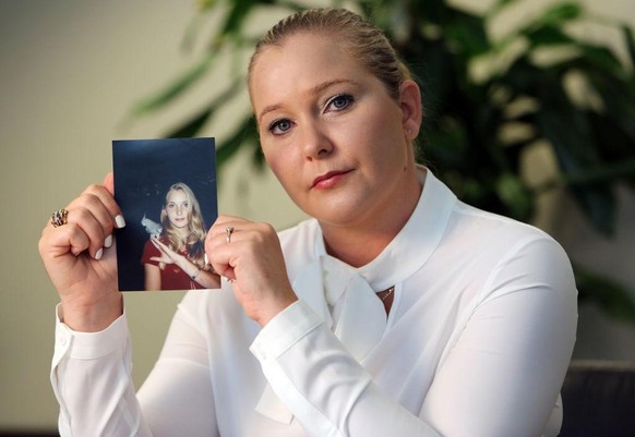 Virginia Roberts holds a photo of herself at age 16, when she says Palm Beach multimillionaire Jeffrey Epstein began abusing her sexually.
(Emily Michot/Miami Herald/Tribune News Service via Getty Ima ...