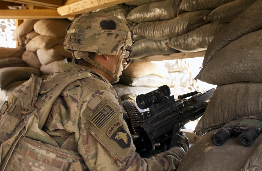 FILE - In this Sept. 8, 2016 file photo, a U.S. Army soldier guards a position at Camp Swift, northern Iraq. Iraq