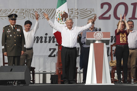epa10333498 Mexico President Andres Manuel Lopez Obrador (C) gestures to supporters during his fourth government report, in the Zocalo city square in Mexico City, Mexico, 27 November 2022. Lopez Obrad ...