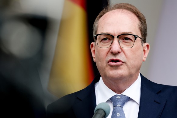 epa13032557 German Interior Minister Alexander Dobrindt speaks during a press conference as he inspects the Central Reception Center for Refugees, a reception facility for asylum seekers and refugees  ...