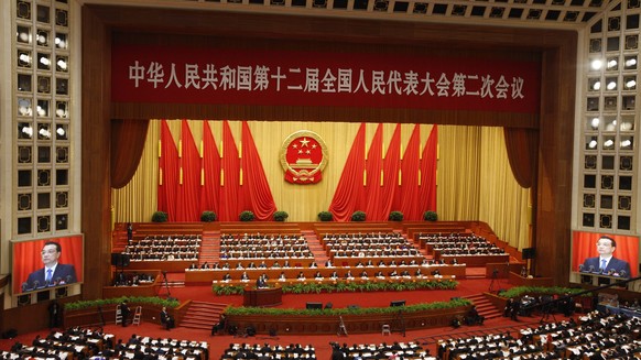 epa04110281 Delegates and officials gather for the Second Session of the 12th National Peoples Congress (NPC) at the Great Hall of the People in Beijing, China, 05 March 2014. The NPC has over 3,000 d ...