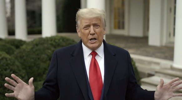 This exhibit from video released by the House Select Committee, shows President Donald Trump recording a video statement on the afternoon of Jan. 6, from the Rose Garden, displayed at a hearing by the ...