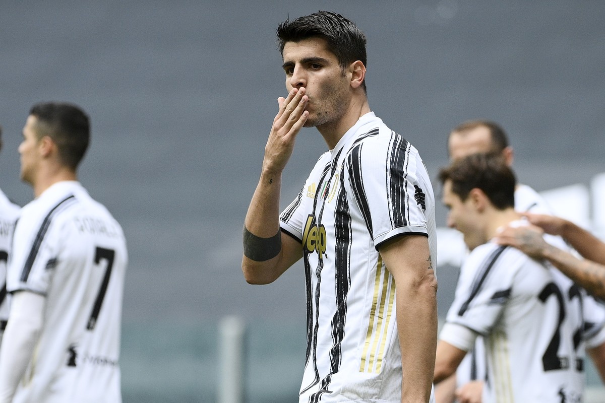 Juventus' Alvaro Morata celebrates after scoring his side's second goal during the Serie A soccer match between Juventus and Genoa, at the Turin Allianz stadium, Italy, Sunday, April 11, 202 ...