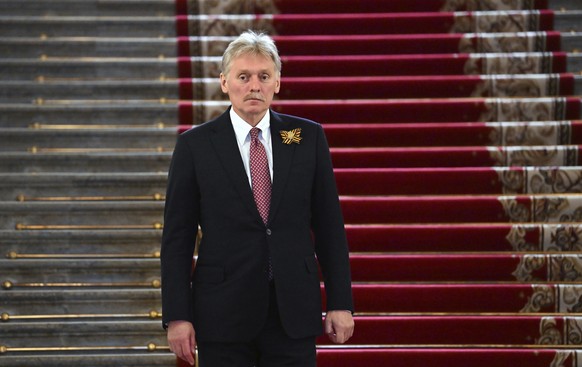 Kremlin spokesman Dmitry Peskov walks down stairs after a reception to honour of the heads of state, during the celebrations to mark the 79th anniversary of the victory over Nazi Germany in World War  ...