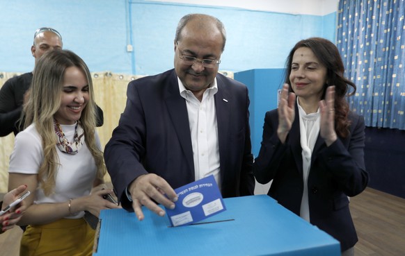 epa07493465 Ahmed Tibi (C), leader of the Hadash-Ta&#039;al party casts hi ballot at a polling station, during the Elections of the 21st Knesset (parliament) of Israel, 09 April 2019. According to the ...