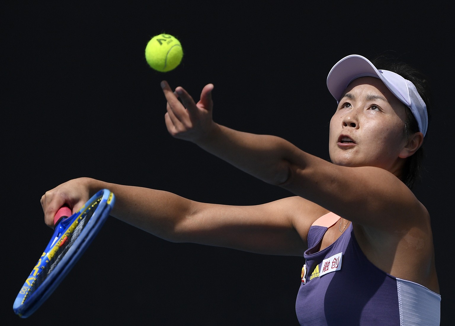 FILE - China&#039;s Peng Shuai serves to Japan&#039;s Nao Hibino during their first round singles match at the Australian Open tennis championship in Melbourne, Australia, on Jan. 21, 2020. China&#039 ...