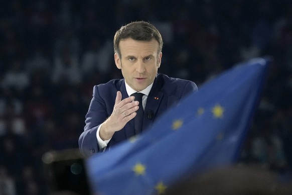 French President Emmanuel Macron and centrist candidate for reelection gestures as he delivers his speech during a meeting in Paris, Saturday, April 2, 2022. France&#039;s first round of the president ...