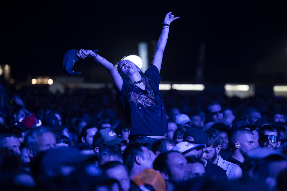 A festivalgoer sings during the concert of American heavy metal band Avenged Sevenfold, on the Jungfrau Stage, at the Greenfield Openair Festival, in Interlaken, Switzerland, Friday, June 13, 2025. Th ...