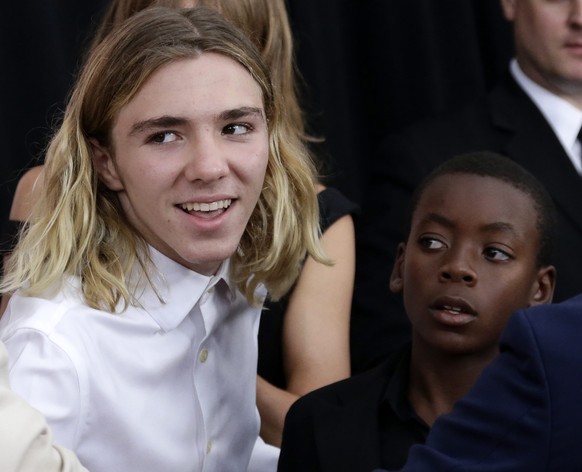 epa04879614 British director Guy Ritchie&#039;s and former wife Madonna son&#039;s, Rocco Ritchie (L) and his brother David Banda Mwale Ciccone Ritchie (R) arrive to the Warner Bros. Pictures &#039;TH ...