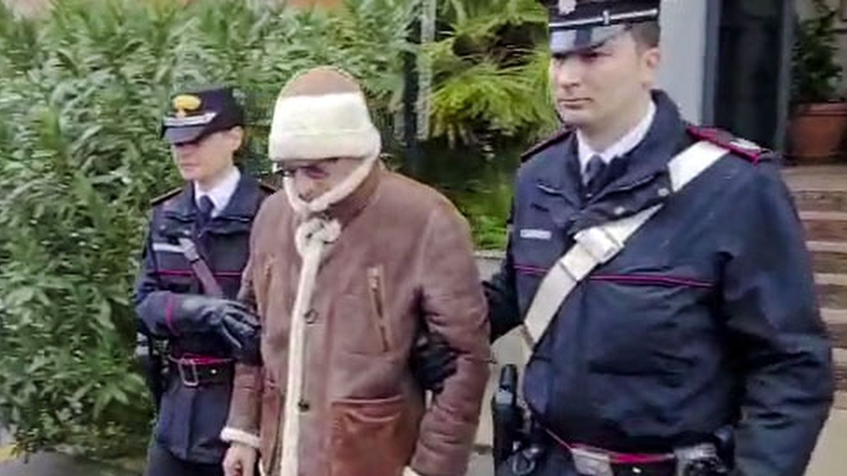 FILE - In this picture taken from a video released by Italian Carabinieri on Monday, Jan. 16, 2023, top Mafia boss Matteo Messina Denaro, center, leaves an Italian Carabinieri barrack soon after his a ...