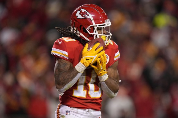 Kansas City Chiefs running back Isiah Pacheco makes the catch against the Cincinnati Bengals during the second half of the NFL AFC Championship playoff football game, Sunday, Jan. 29, 2023, in Kansas  ...