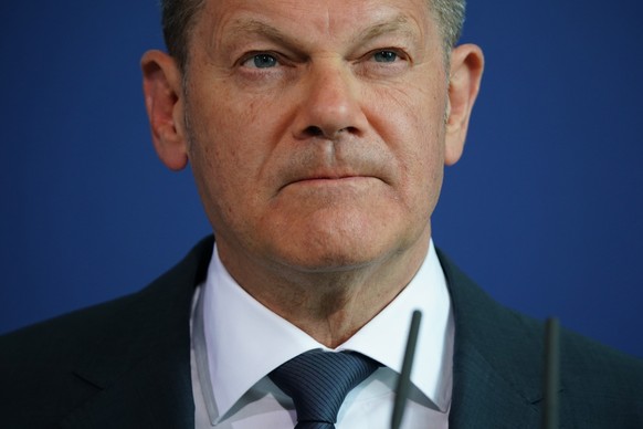 epa09897509 German Chancellor Olaf Scholz looks on as he speaks during a statement at the Chancellery in Berlin, Germany, 19 April 2022. German Chancellor Olaf Scholz delivered a statement after telep ...