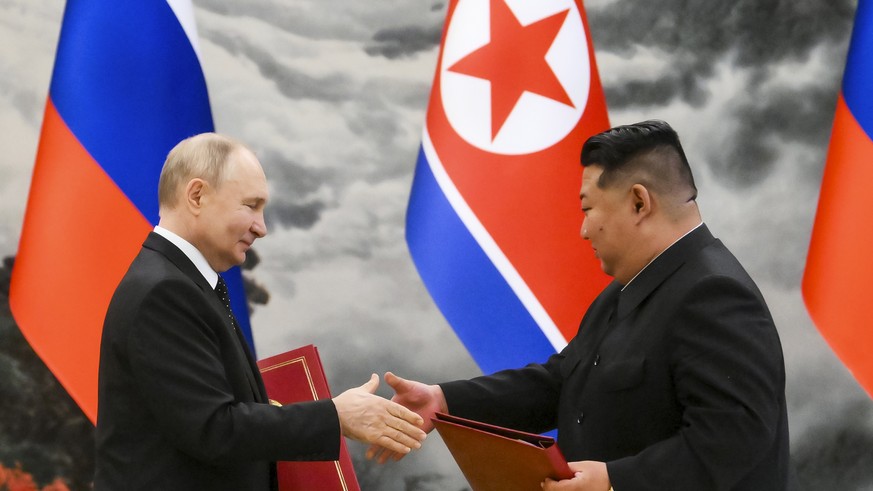 FILE - Russian President Vladimir Putin, left, and North Korea&#039;s leader Kim Jong Un exchange documents during a signing ceremony of the new partnership in Pyongyang, North Korea, on June 19, 2024 ...