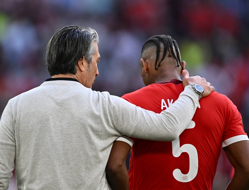 DUSSELDORF, GERMANY - JULY 6: Murat Yakin, head coach of Switzerland, Manuel Akanji during the UEFA EURO, EM, Europameisterschaft,Fussball 2024 quarter-final match between England and Switzerland at D ...