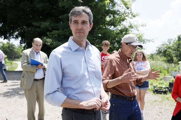 Democratic presidential candidate Beto O&#039;Rourke tours the Coyote Run Farm with farmer Matt Russell, right, Friday, June 7, 2019, in Lacona, Iowa. (AP Photo/Charlie Neibergall)