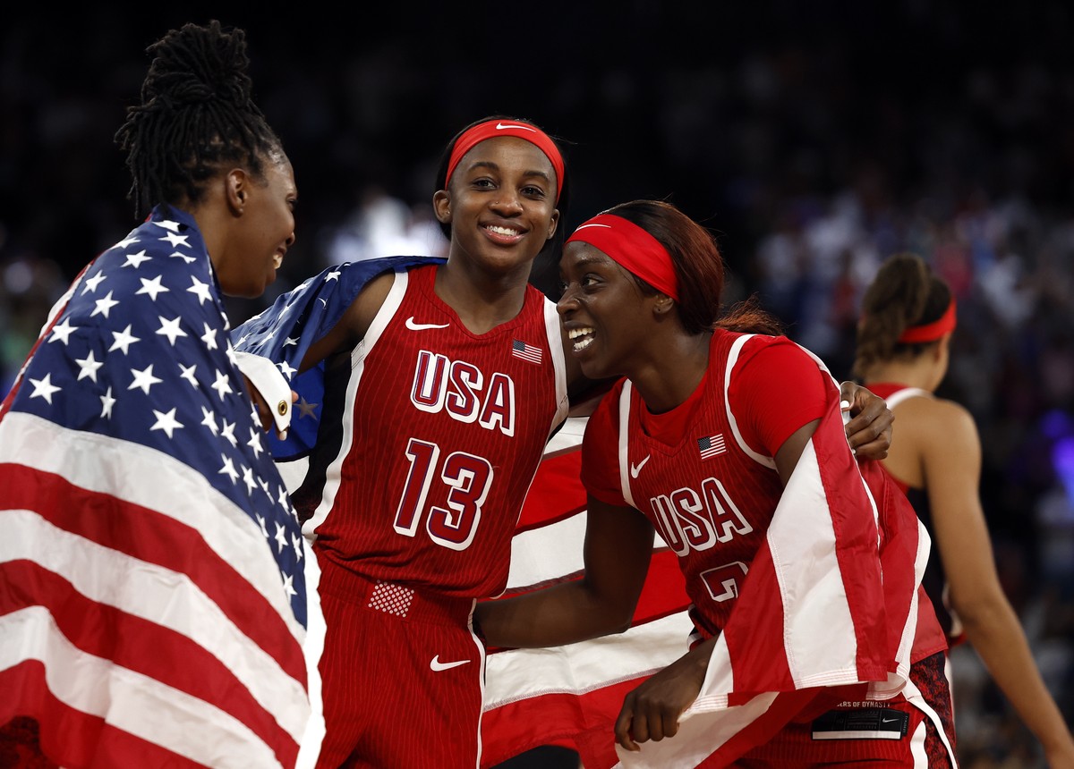 epa11545703 USA players celebrate after winning the Women Gold Medal game between France and USA of the Basketball competitions in the Paris 2024 Olympic Games, at the South Paris Arena in Paris, Fran ...