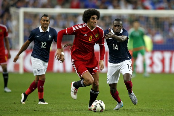 France&#039;s Blaise Matuidi challenges Belgium&#039;s Marouane Fellaini (C) during their international friendly soccer match at the Stade de France stadium in Saint-Denis, near Paris, France June 7,  ...