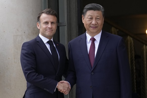 French President Emmanuel Macron shakes hands with China&#039;s President Xi Jinping before their meeting at the Elysee Palace, Monday, May 6, 2024 in Paris. French President Emmanuel Macron is welcom ...