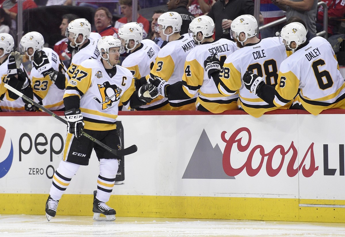 Pittsburgh Penguins center Sidney Crosby (87) celebrates his goal with the bench during the second period of Game 1 of the team's NHL hockey Stanley Cup second-round playoff series against the Wa ...