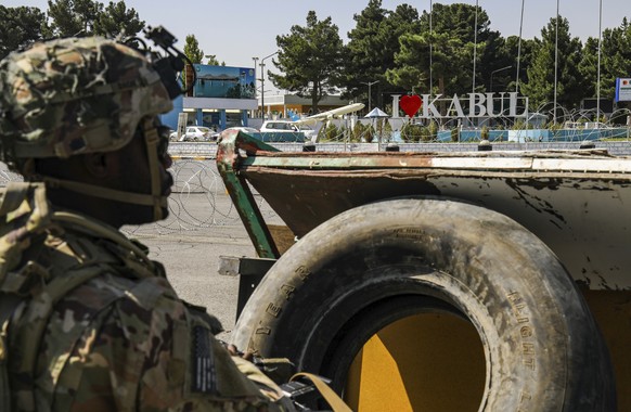 In this image provided by the U.S. Army, a paratrooper assigned to the 1st Brigade Combat Team, 82nd Airborne Division monitors security during evacuations at Hamid Karzai International Airport in Kab ...