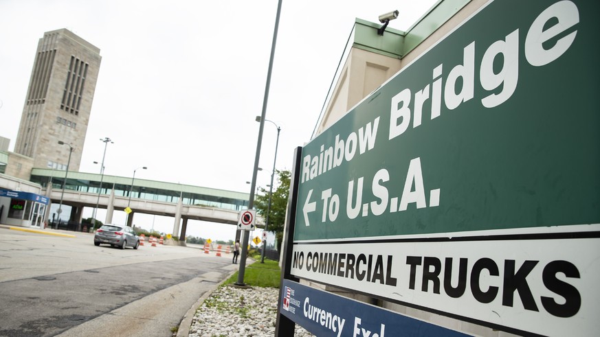 FILE - A vehicle crosses the International Rainbow Bridge from Niagara Falls, Ontario, into Niagara Falls, N.Y. on Wednesday, Oct. 13, 2021. A border crossing between the U.S. and Canada has been clos ...