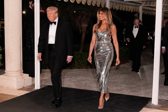 President Donald Trump and first lady Melania Trump arrive for a New Year's Eve celebration at his Mar-a-Lago club, Wednesday, Dec. 31, 2025, in Palm Beach, Fla. (AP Photo/Alex Brandon)
Donald Tr ...