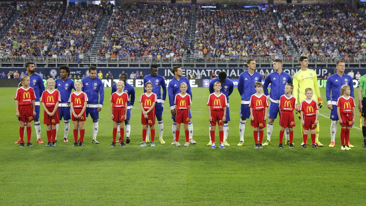 IMAGE DISTRIBUTED FOR INTERNATIONAL CHAMPIONS CUP - AC Milan and Chelsea FC players are escorted onto the pitch by McDonald's Kids ahead of their International Champions Cup soccer match on Wedne ...