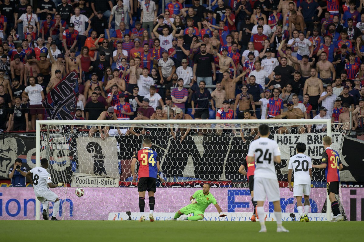 Tobol's Serge Deble, left, scores with a penalty shot during the UEFA Conference League second qualifying round first leg match between Switzerland's FC Basel 1893 and Kazakhstan's FC T ...