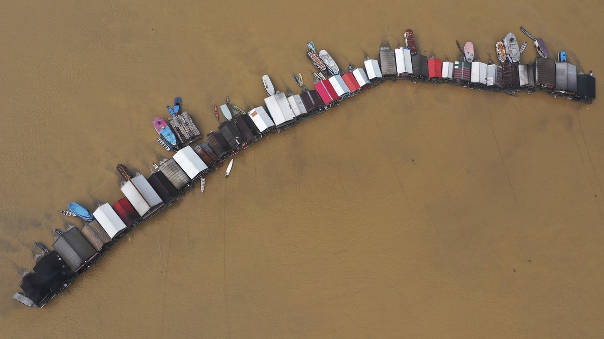 Dredging barges operated by illegal miners converge on the Madeira river, a tributary of the Amazon river, searching for gold, in Autazes, Amazonas state, Brazil, Thursday, Nov.25, 2021. Hundreds of m ...