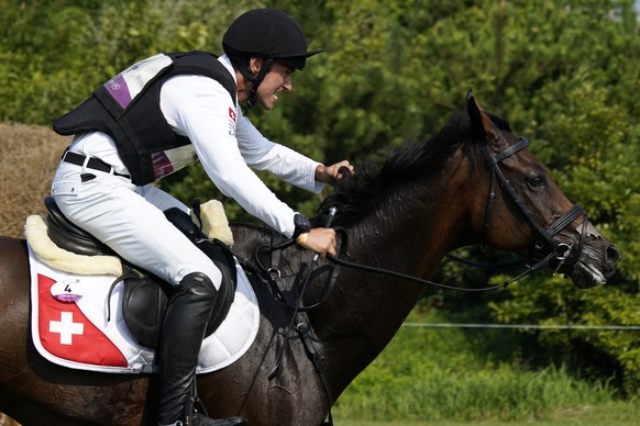 Switzerland&#039;s Felix Vogg, riding Colero, competes during the equestrian eventing cross county competition at the Sea Forest Cross-Country Course in Tokyo at the 2020 Summer Olympics, Sunday, Aug. ...