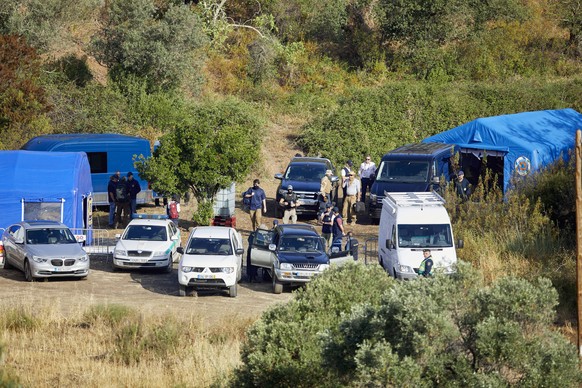 epa10649389 Portuguese authorities gather at a Judiciary Police (PJ) makeshift base camp in the Arade dam area, Faro district, during the new search operation amid the investigation into the disappear ...