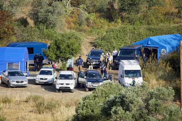 epa10649389 Portuguese authorities gather in an improvised base camp of the Judicial Police (PJ) in the area of ​​​​the Arade Dam, in the district of Faro, during the new search during the investigation of the disappearance ...