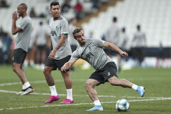 epa07771678 Liverpool's Roberto Firmino (L) and Liverpool's Xherdan Shaqiri (R) during a training session of Liverpool FC in Istanbul, Turkey, 13 August 2019. Liverpool FC will face Chelsea FC in the  ...