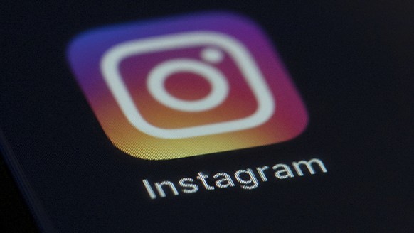 FILE - This Friday, Aug. 23, 2019 file photo shows the Instagram app icon on the screen of a mobile device in New York. Celebrities including Kim Kardashian West, Katy Perry and Leonardo DiCaprio are  ...