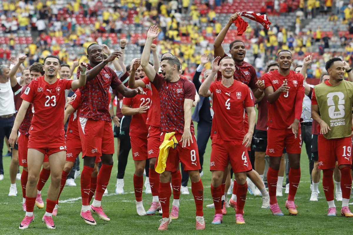 Switzerland's Zeki Amdouni, Denis Zakaria, Remo Freuler, Nico Elvedi, Aurele Amenda, Manuel Akanji and Noah Okafor, from left, celebrate after the victory in the World Cup round of 16 soccer matc ...