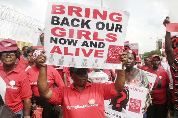 FILE - Bring back our girls campaigners chant slogans during a protest calling on the government to rescue the remaining kidnapped girls of the government secondary school who were abducted almost thr ...