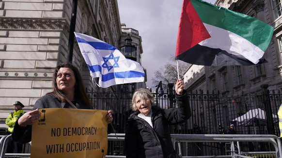 Protestors demonstrate during the visit of Israeli Prime Minister Benjamin Netanyahu to 10 Downing Street in London, Friday, March 24, 2023.(AP Photo/Alberto Pezzali)
