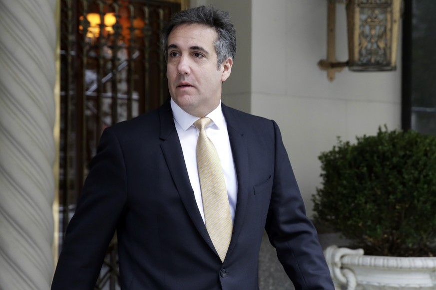 Michael Cohen, former personal lawyer to President Donald Trump, leaves his apartment building, in New York, Tuesday, Aug. 21, 2018. Cohen could be charged before the end of the month with bank fraud  ...